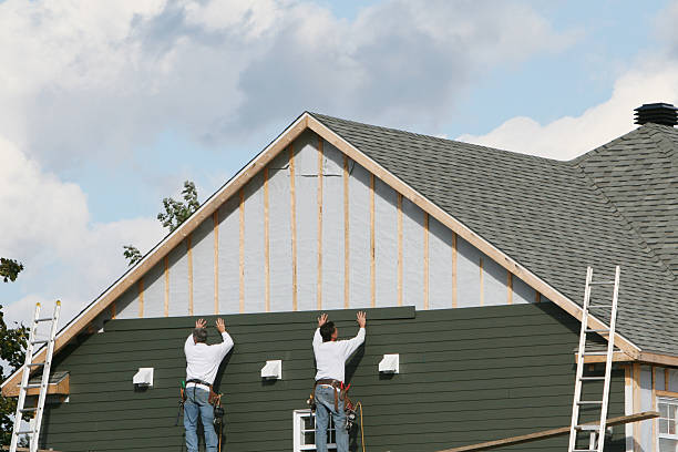Professional Siding Contractor technician working in Boston, IN